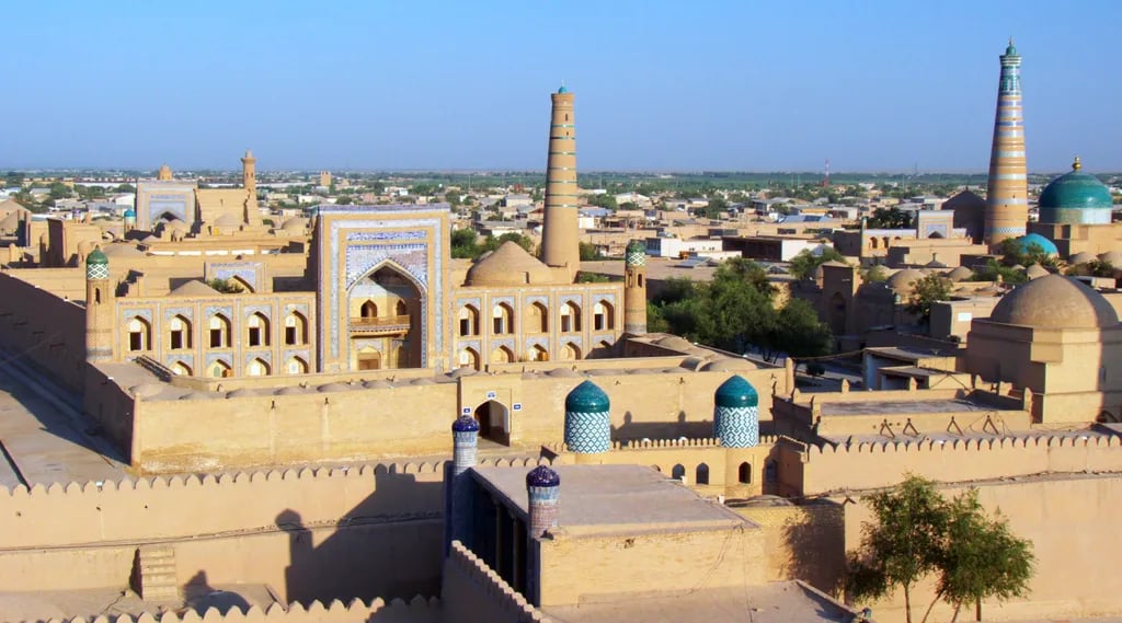Khiva, Uzbekistan travel destination - scenic view of Sunrise Over the Ichon Kala Walls during ideal visiting season