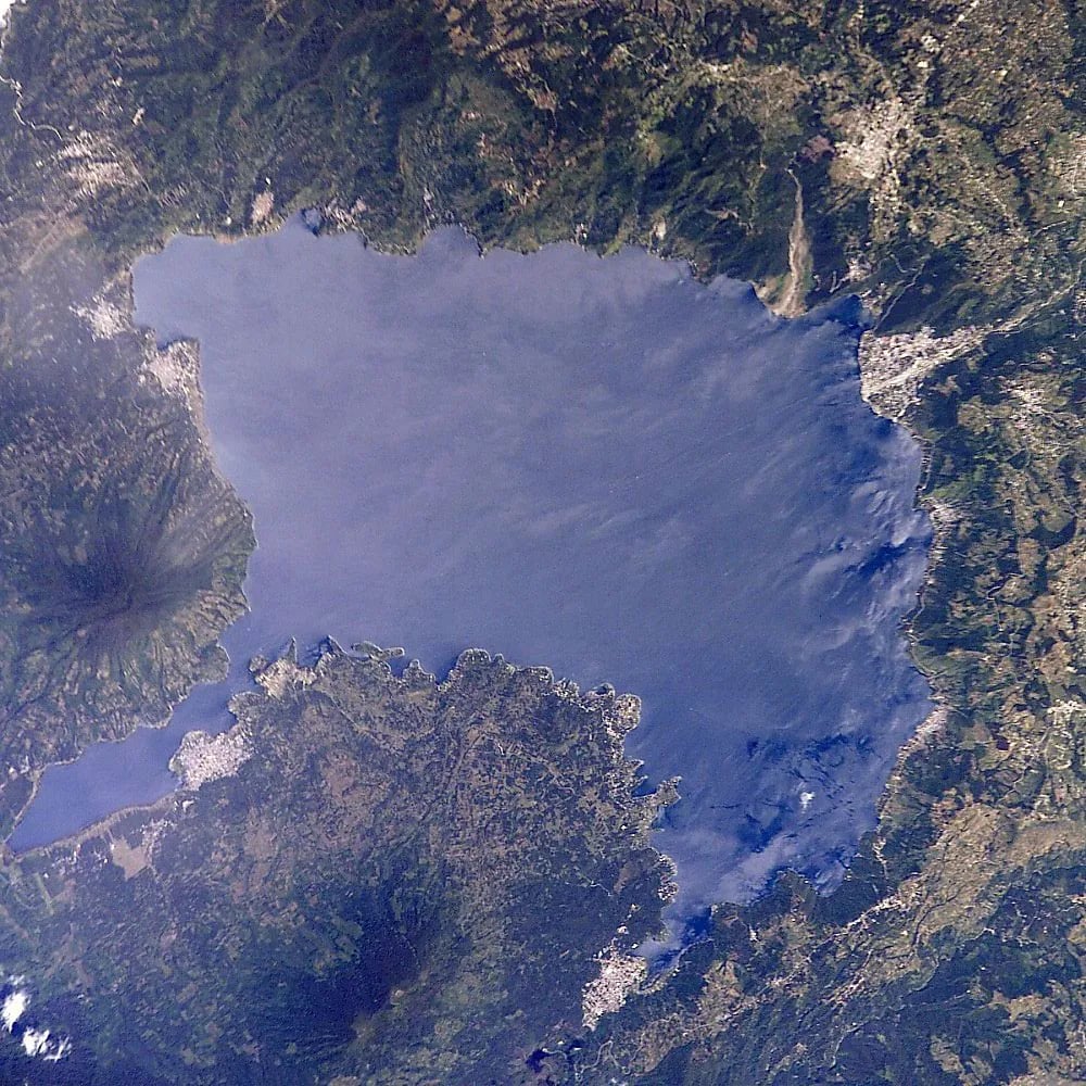 Lake Atitlán, Guatemala travel destination - scenic view of Sunrise Kayak on the Glassy Lake during ideal visiting season