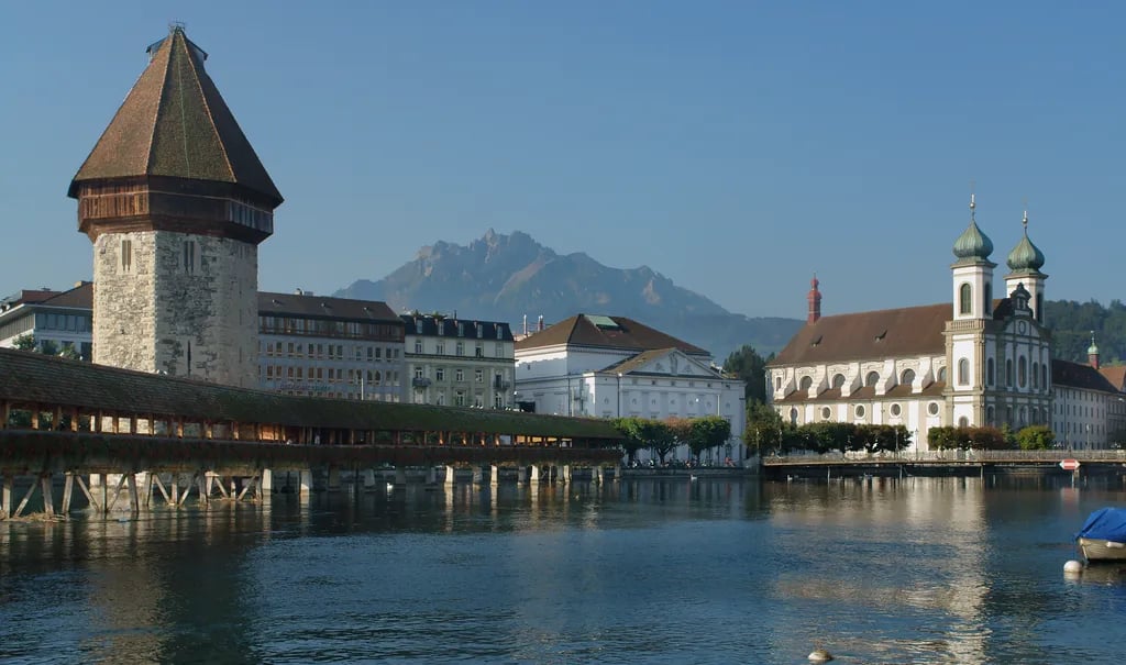 Lucerne, Switzerland travel destination - scenic view of Chapel Bridge at Dawn during ideal visiting season