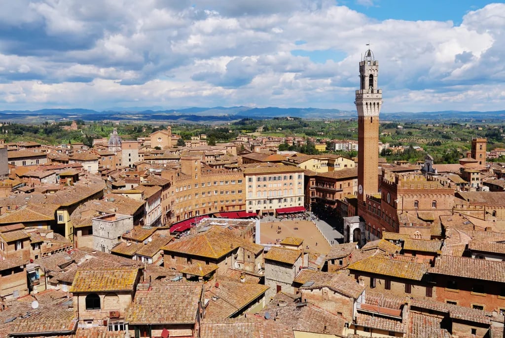 Siena, Italy travel destination - scenic view of Sunrise Over Piazza del Campo during ideal visiting season