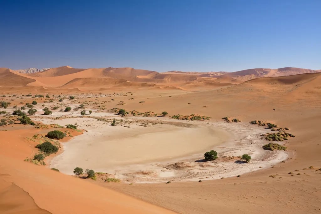 Sossusvlei, Namibia travel destination - scenic view of Sunrise Symphony at Dune 45 during ideal visiting season