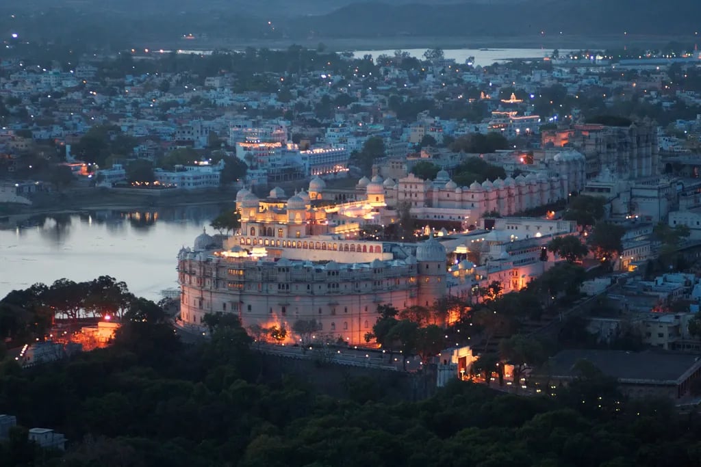 Udaipur, India travel destination - scenic view of Sunrise Boat Ride on Lake Pichola during ideal visiting season