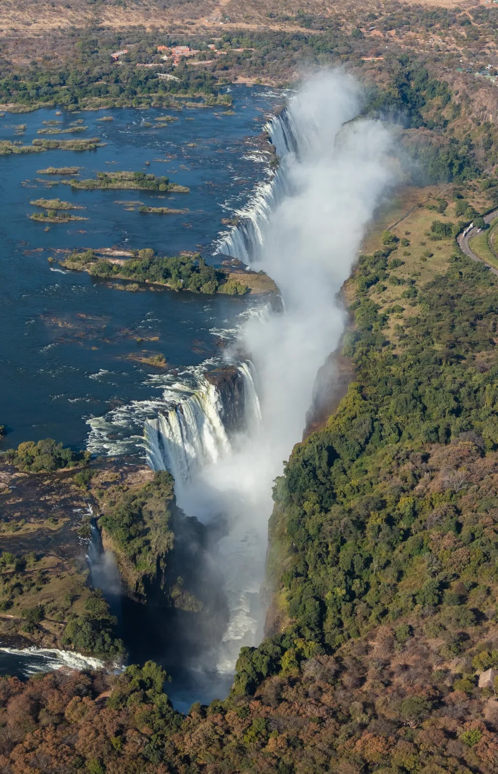 Victoria Falls, Zambia/Zambia/Zimbabwe travel destination - scenic view of The Smoke That Thunders: Devil's Pool Dip during ideal visiting season